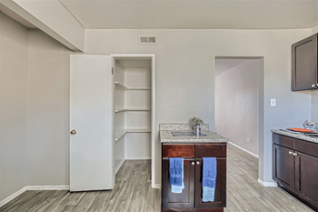 Apartment kitchen with pantry area at South Federal Apartments